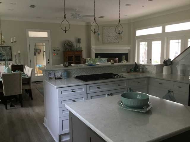 Kitchen remodel after is an open spacious design.